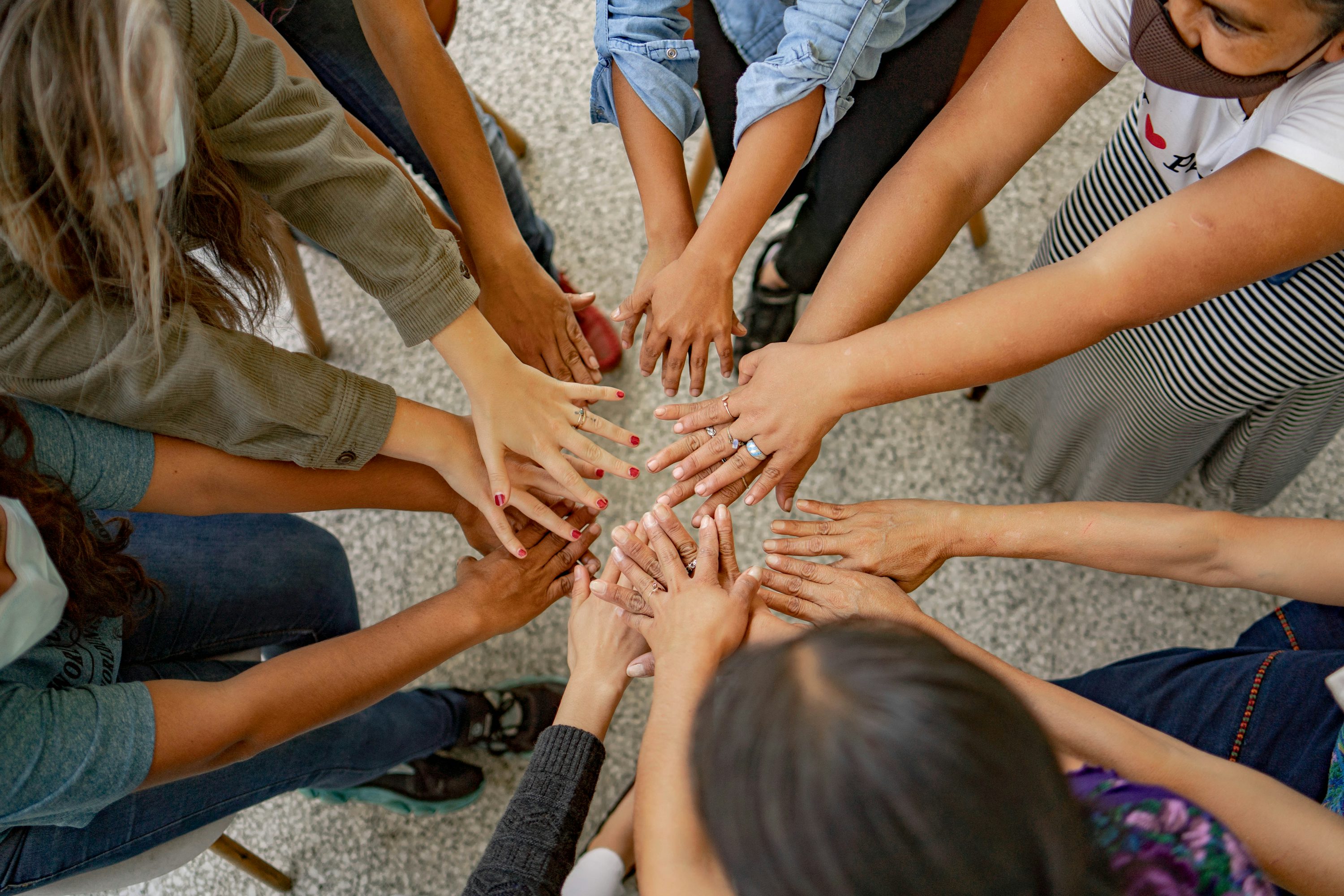 Community Leaders image - of community putting hands together